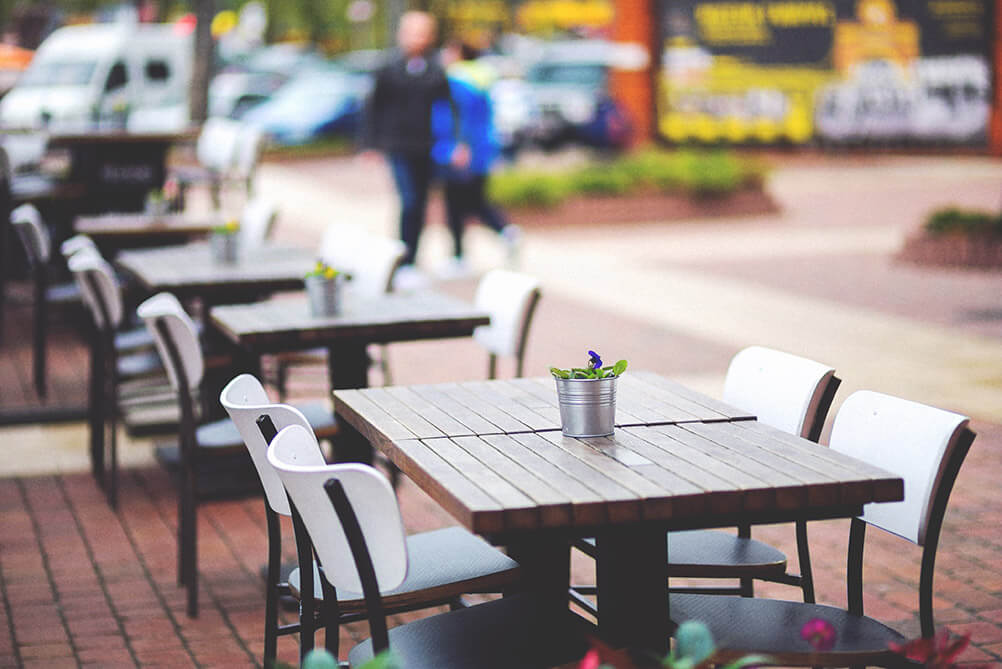 Empty seats at a restaurant with outdoor seating